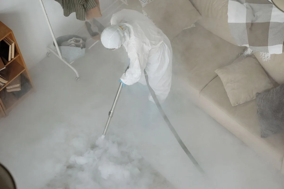 Biohazard cleanup technician in protective equipment, Belleview, FL